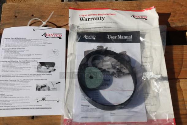 Avantco SL713MAN meat slicer manuals and warranty papers. Includes handling instructions and a damaged blade guard bracket.