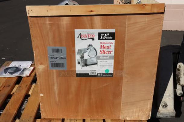 Brand new Avantco SL713MAN 13" meat slicer in crate; medium-duty, 3/4 hp, 120V. Note: blade guard bracket damaged.