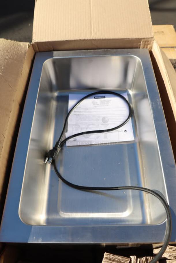 Brand new Nemco 6055A 12" x 20" countertop food warmer. In working order, slight cosmetic scratches from packaging. 120V, 1200W.