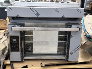 Brand new Cadco Rossella XAF-193 convection oven, 4-shelf, heavy-duty, outer glass broken, includes aluminum stand with casters.