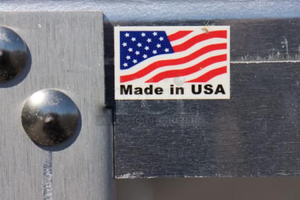 "Made in USA" label on a metal surface of Cadco XAF-193 convection oven stand.