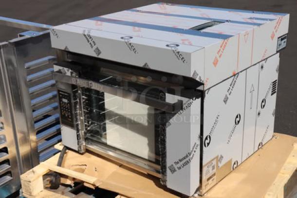 BRAND NEW Cadco XAF-193 4-shelf convection oven, damaged outer glass, with Cadco OST-195-C stand, on pallet. Model XAF-193.