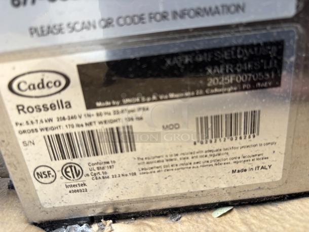 Cadco Rossella XAF-193 convection oven label, showing specs and serial number 2025F0070388. Outer glass pane broken. Made in Italy.
