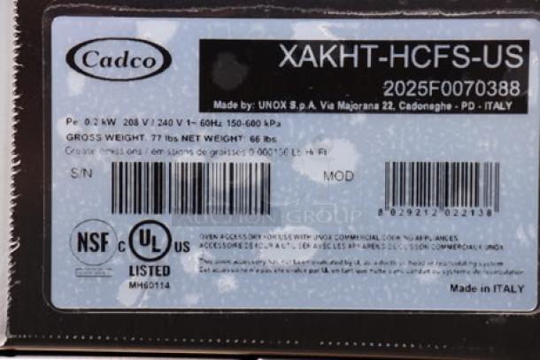 Cadco label with model XAF-193. Serial: 2025F0070388. Outer glass pane broken; details specifications and certifications.