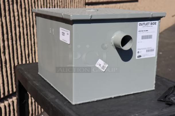 Brand new Zurn Elkay GT2700-15-2NH 30 lb. grease trap with 15 GPM capacity and 2" no-hub connections, out of packaging.
