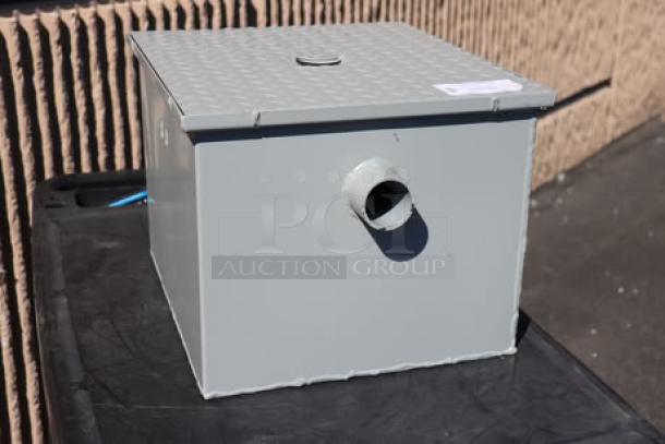 BRAND NEW Zurn Elkay GT2700-15-2NH 30 lb. 15 GPM grease trap, gray, 2" no-hub connections, out of original packaging.