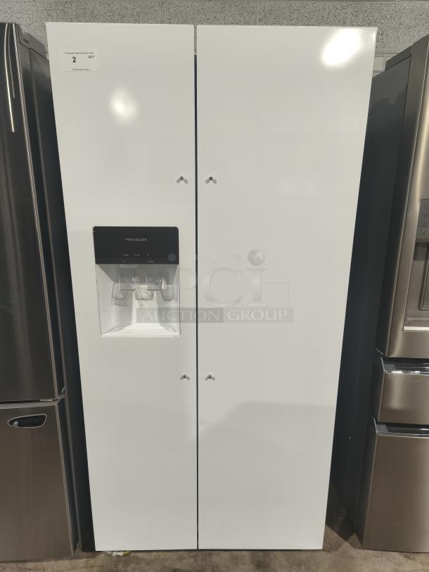 Frigidaire 22.3 Cu. Ft. side-by-side refrigerator, model FRSS2323AW, brand new with minor scratches and dents, white exterior.