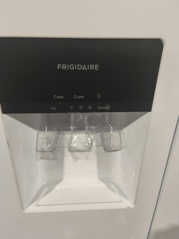 Frigidaire FRSS2323AW refrigerator ice and water dispenser panel, black with options for cube, crush, and water.