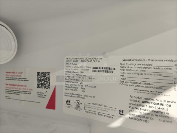 Frigidaire 22.3 Cu. Ft. Side-by-Side Refrigerator, Model FRSS2323AW. New, scratch and dent condition. Label shows dimensions and specs.