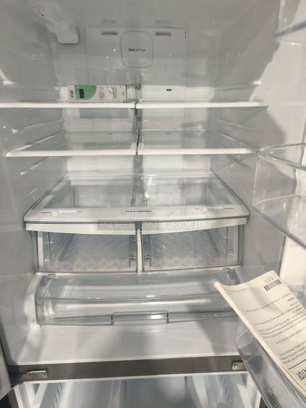 Brand new LG 22 cu ft French door refrigerator with water and ice dispenser, minor scratches, model LFDS22520S.