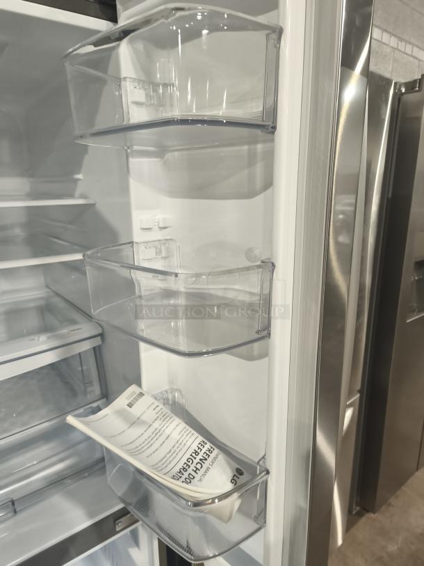Brand new LG 22 cu ft French Door Refrigerator with visible scratch and dent. Includes water/ice dispenser, model LFDS22520S.