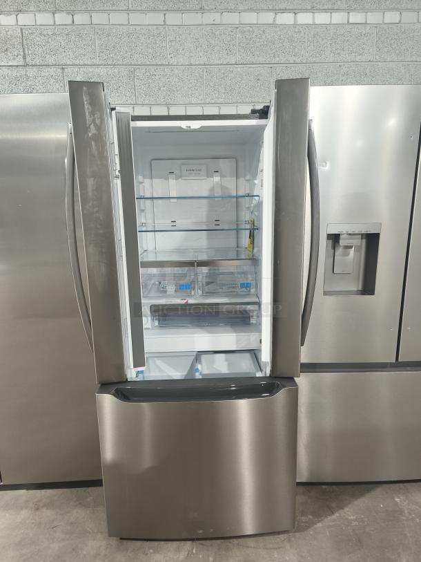 NEW Frigidaire Gallery 20 cu ft French Door Refrigerator, model GRFN2023AF00, stainless steel, open doors, pristine condition.