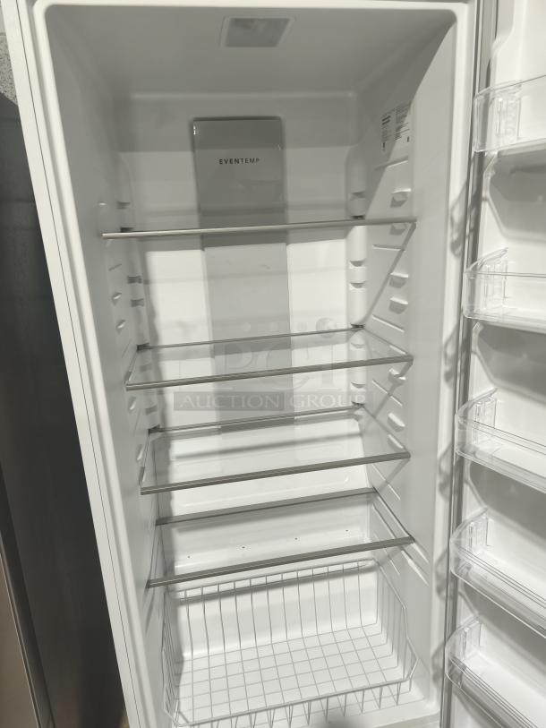 Frigidaire 20 cu ft upright freezer, model FFUE2024AW, garage-ready, new condition, adjustable shelves, Eventemp feature.