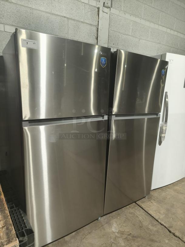 NEW Midea MRT18D3BST 18.1 cu ft top-freezer refrigerator, stainless steel, energy-efficient, visible stickers, pristine condition.