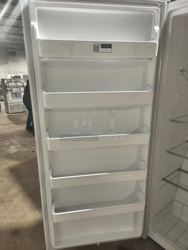 NEW Frigidaire 20 cu. ft. garage-ready upright freezer, model FRUF2020AW, features spacious door shelves, in mint condition.