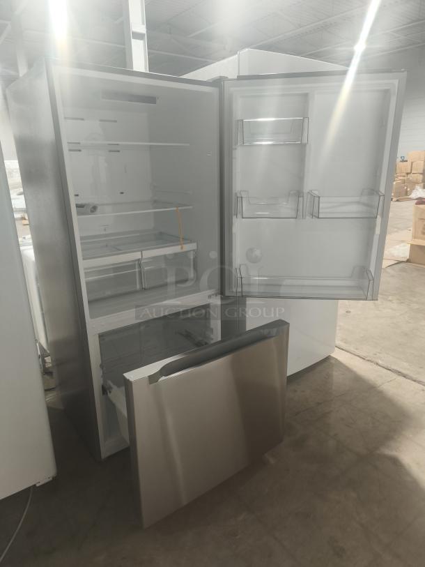 Midea 18.7 cu. ft. bottom-mount freezer refrigerator, model MRB19B7AST, new condition. Open doors reveal interior storage.