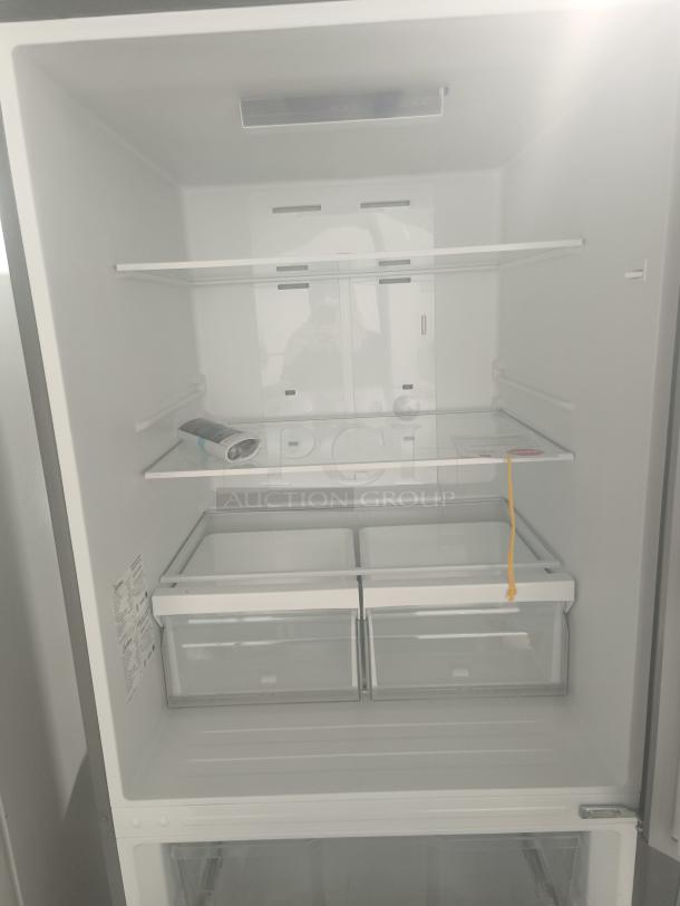 New Midea 18.7 cu. ft. bottom-mount freezer refrigerator, model MRB19B7AST, features spacious shelves and dual drawers.