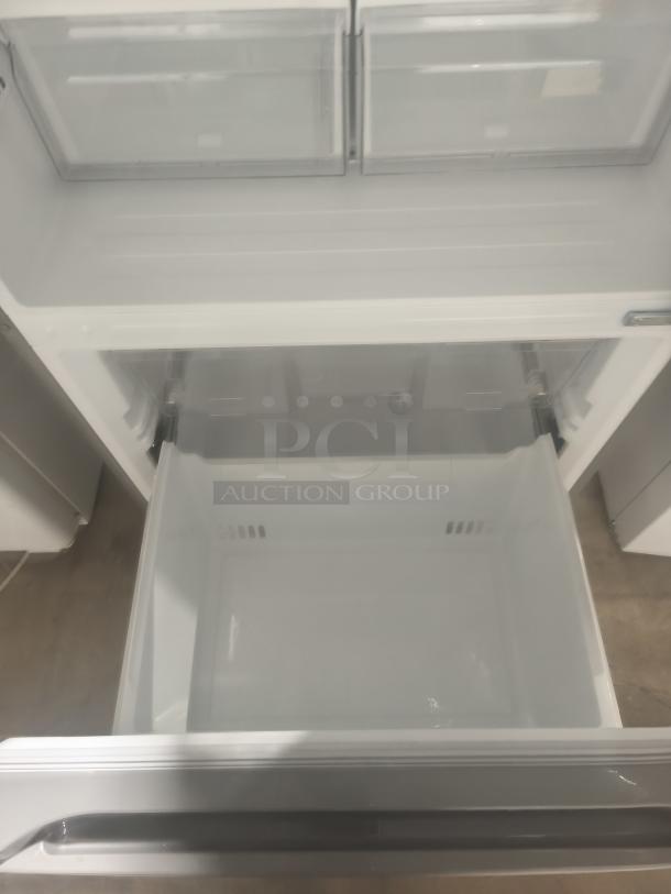 New Midea 18.7 cu. ft. bottom-mount freezer refrigerator, model MRB19B7AST, open view, pristine condition.