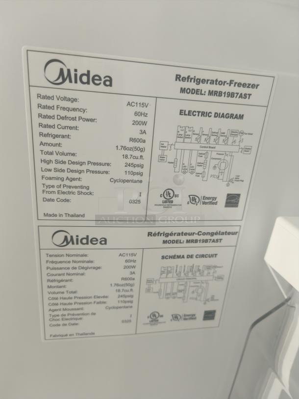 Midea MRB19B7AST 18.7 cu. ft. bottom-mount freezer refrigerator, new. Label shows model, voltage, and design specifications.