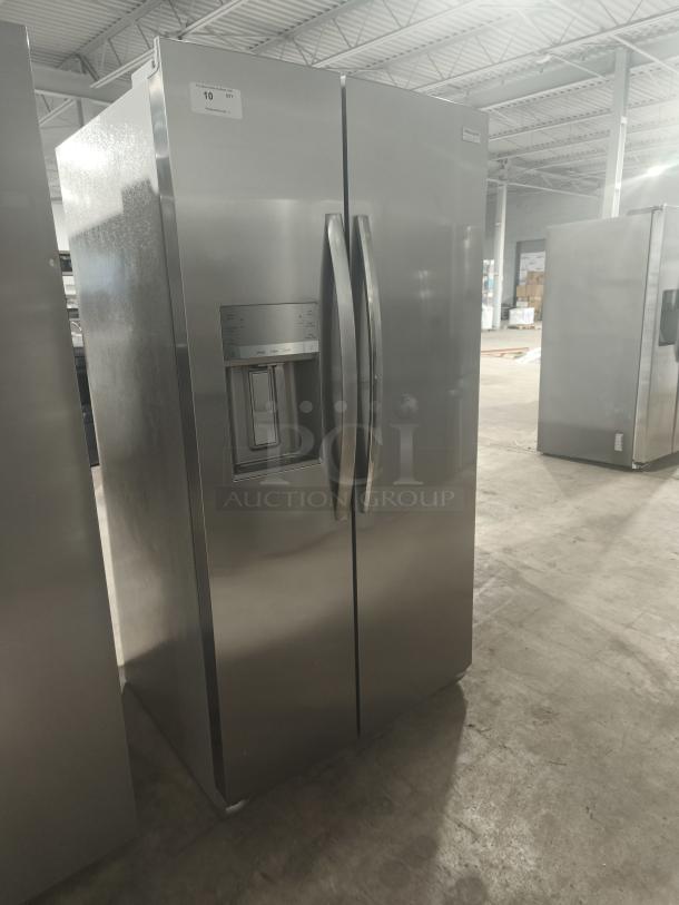 Frigidaire Gallery 25.6 cu ft side-by-side refrigerator, model GRSS2652AFA, new condition, stainless steel finish.