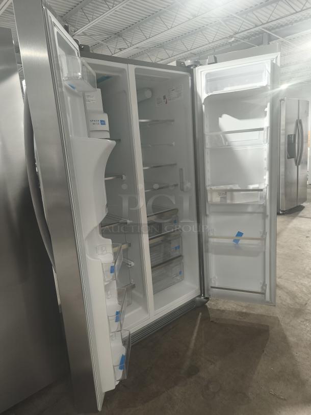 Frigidaire Gallery GRSS2652AFA 25.6 cu ft side-by-side refrigerator, new, stainless steel, open doors showing spacious interior.