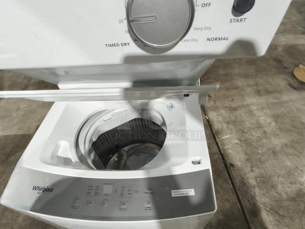 Whirlpool 1.6 cu. ft. electric stacked laundry center, model WET4024HW. New condition, intuitive controls visible.