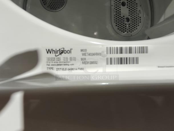 Whirlpool 1.6 cu. ft. Electric Stacked Laundry Center, Model WET4024HW, new condition, showing label with serial info.