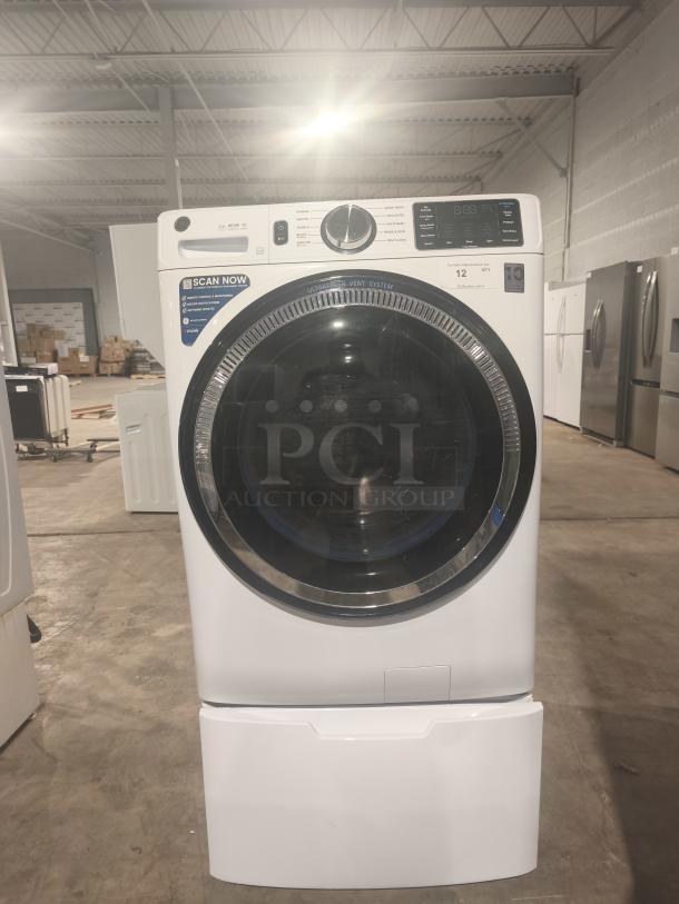 GE 4.8 cu ft Smart Front Load Washer, model GFW550SSN2WW, white, excellent condition, visible control panel and vent system label.