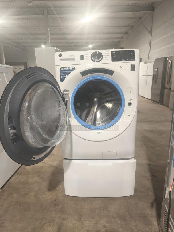GE 4.8 cu ft Smart Front Load Washer, model GFW550SSN2WW, open door, white finish, excellent condition, digital controls visible.