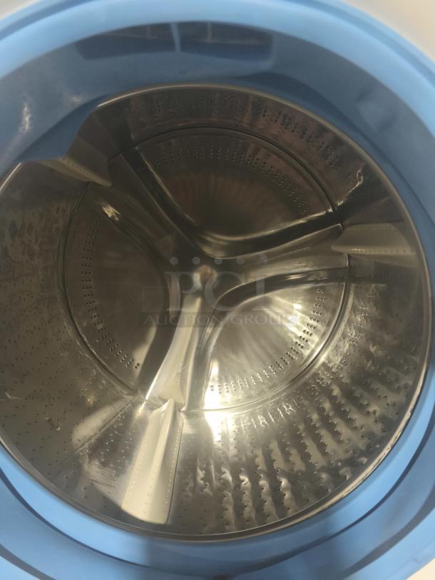GE 4.8 cu ft Smart Front Load Washer drum, stainless steel interior, model GFW550SSN2WW, new condition.