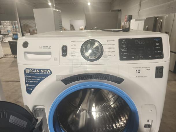 GE 4.8 cu ft Smart Front Load Washer, Model GFW550SSN2WW, white, with digital controls and blue-ringed drum, in excellent condition.