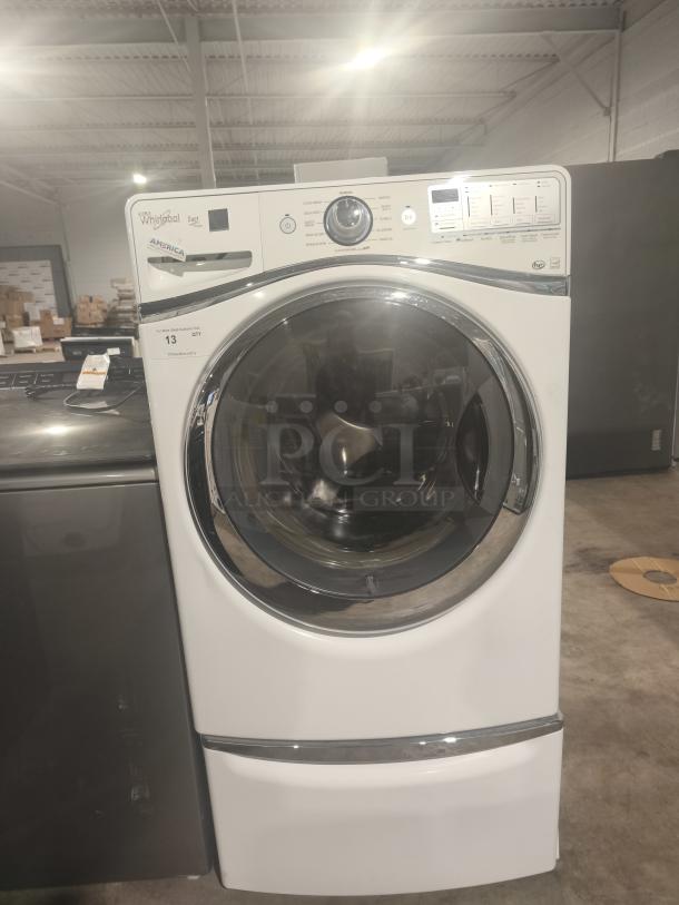 Whirlpool Duet® Steam Front Load Washer, Model WFW94HEAW, in good condition, featuring a sleek white design with control panel.
