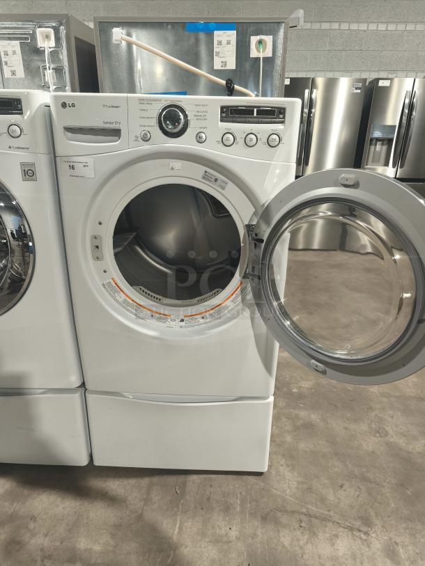 LG 7.3 cu ft Ultra-Large Capacity SteamDryer, model DLEX2650W, open door, front view, excellent condition.