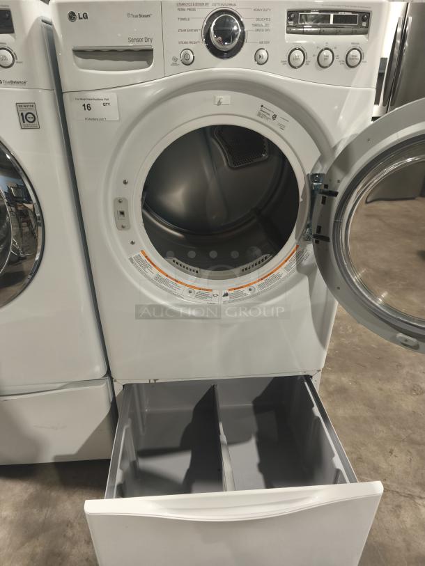 LG 7.3 cu ft Ultra-Large Capacity SteamDryer, model DLEX2650W, in excellent condition with open drum and storage drawer.