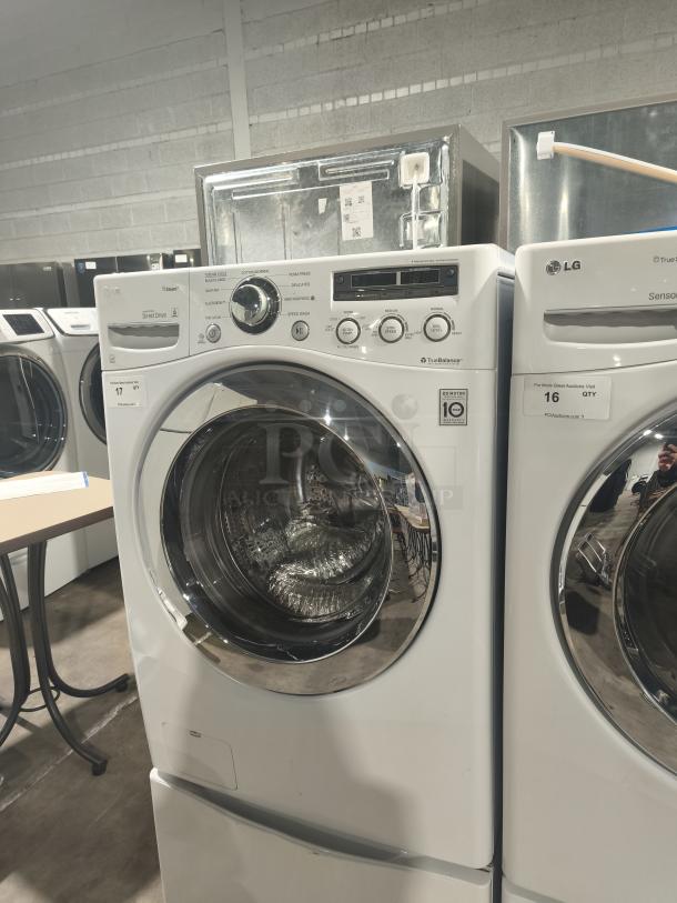 LG WM2650HWA SteamWasher™ front-load washer, white, tested and working. Features TrueBalance and Direct Drive technology.