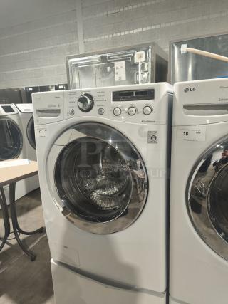 LG WM2650HWA SteamWasher™ front-load washer, white, tested and working. Features TrueBalance and Direct Drive technology.