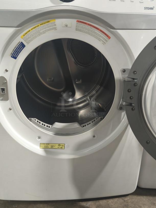 Samsung 7.3 cu ft electric steam dryer, model DV407AEW/XAA, tested and working, open door, interior view, warning labels visible.