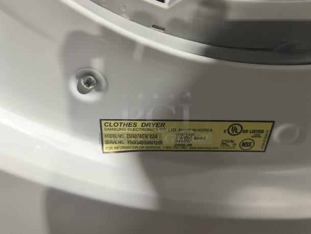 Samsung 7.3 cu ft Electric Steam Dryer, Model DV407AEW/XAA, tested working. Label shows model, serial number, safety certifications.