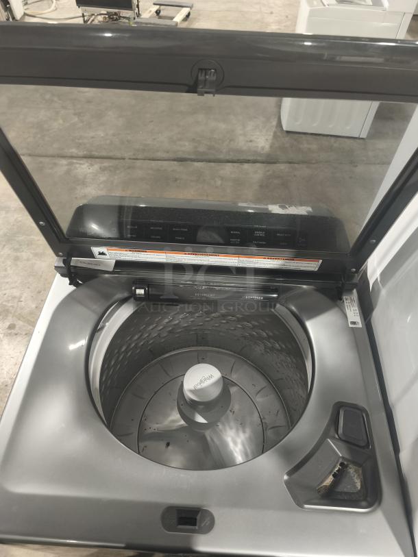 Whirlpool 4.7 cu ft top-load washer, model WTW5105HC2, with pretreat station. Silver drum, tested and working condition.