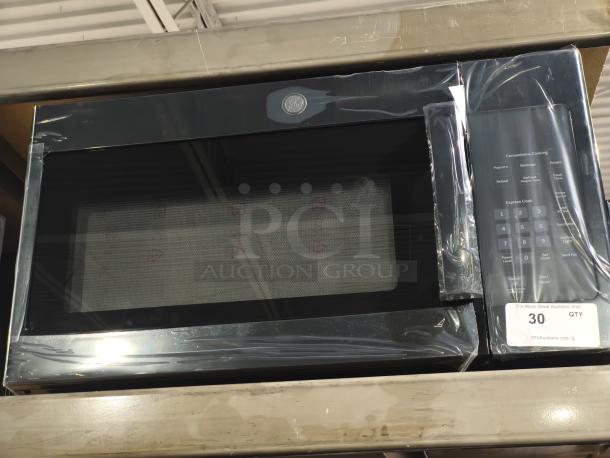 Brand new GE JVM3160DFBB 1.6 cu ft over-the-range microwave oven, visible scratch and dent, black finish.
