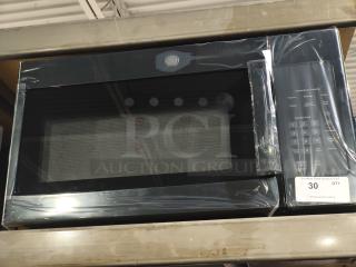 Brand new GE JVM3160DFBB 1.6 cu ft over-the-range microwave oven, visible scratch and dent, black finish.