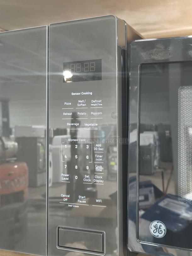 Brand new GE Profile 2.2 cu ft built-in microwave model PCWK22U1WDD. Scratch and dent; sensor cooking options, black finish.