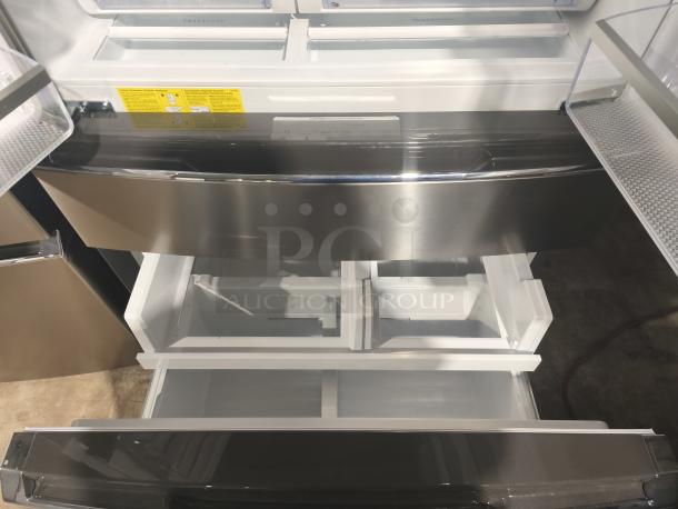 Frigidaire Gallery 21.5 cu ft French Door Refrigerator, model GRMC2273CF04, new condition, interior view with open drawers.