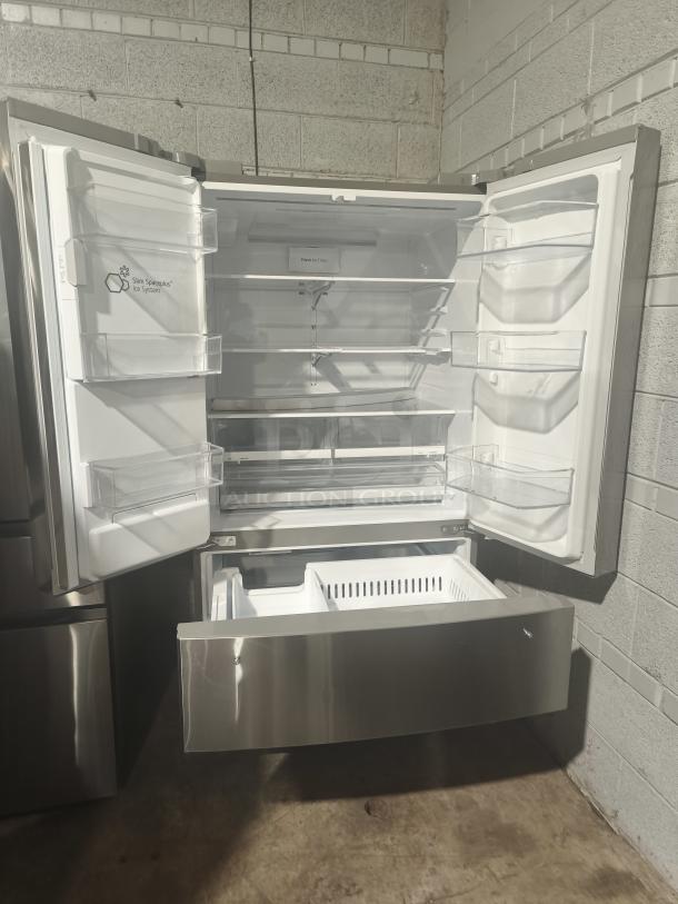 LG 27.8 cu ft Smart French Door Refrigerator, Model LRMXS2806S/05. New condition with Craft Ice feature. Open view.