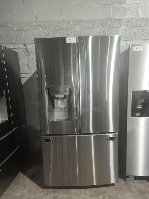 LG LRFS28XBS 27.7 cu ft Smart French Door Refrigerator, new condition, stainless steel, with water dispenser.