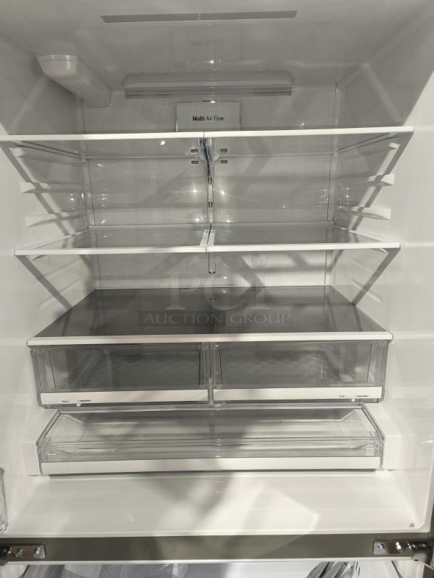 NEW LG 28 cu ft 3-Door Smart French Door Refrigerator interior; features Multi Air Flow, adjustable glass shelves, and clear drawers. Model LRFS28XBS/05.