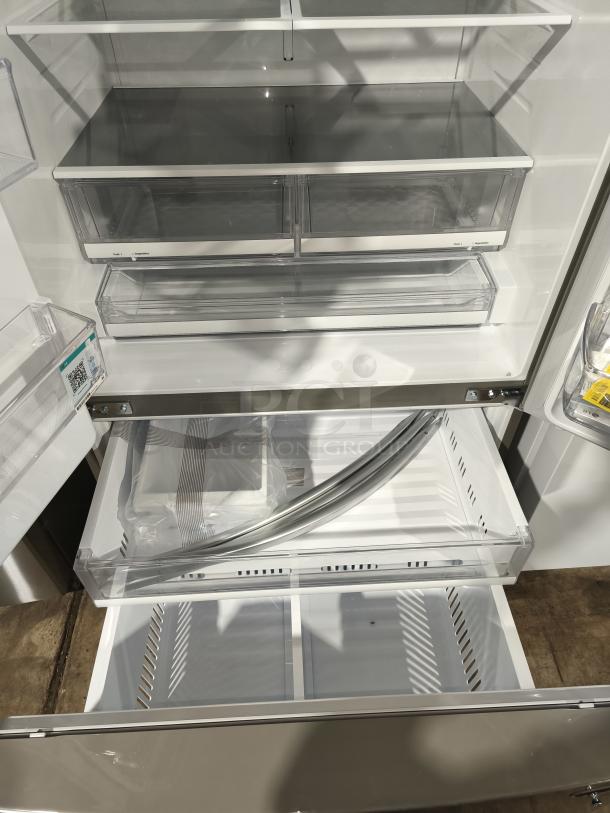 LG 28 cu ft 3-Door Smart French Door Refrigerator, model LRFS28XBS/05, new, interior view with spacious shelves and drawers.