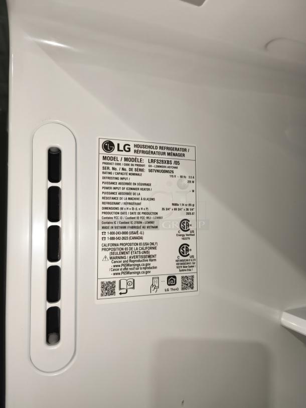 New LG 28 cu ft 3-Door Smart French Door Refrigerator, Model LRFS28XBS/05, with ice and water dispenser. Tags indicate energy efficiency, production details, and safety warnings.