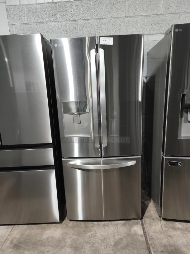 NEW LG 21.8 cu ft 3-Door French Door Refrigerator, model LFDS22520S/06, with external water dispenser, stainless steel finish.