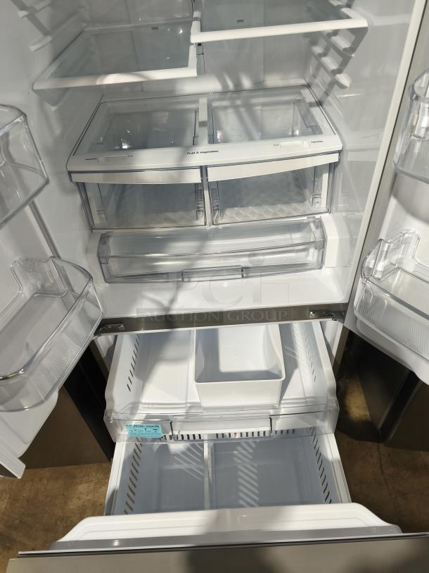 NEW LG 21.8 cu ft 3-Door French Door Refrigerator LFDS22520S/06, features external water dispenser, spacious interior.